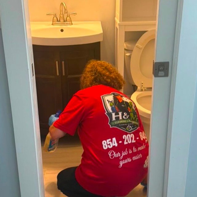 H&M Cleaning Lab technician deep cleaning a bathroom